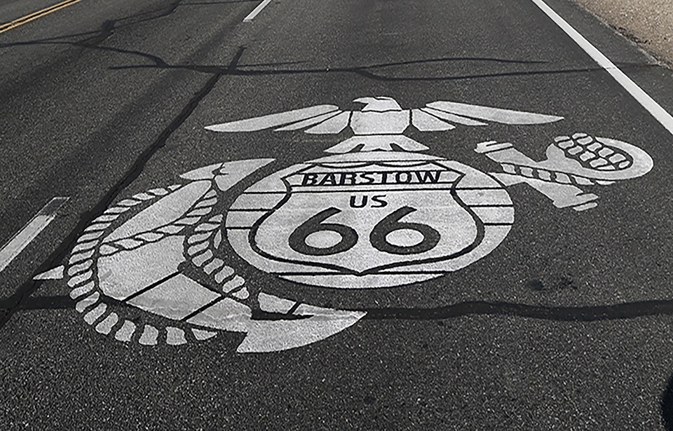 The new Eagle, Globe, and Anchor design including the Route 66 logo, is stenciled on Joseph Boll Ave., which is also part of the historic Route 66 aboard Marine Corps Logistics Base Barstow, California. (Photo Credit: Laurie Pearson / U.S. Marines / Public Domain)
