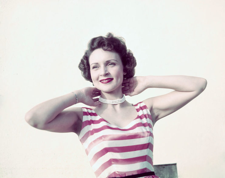 Betty White holding her neck