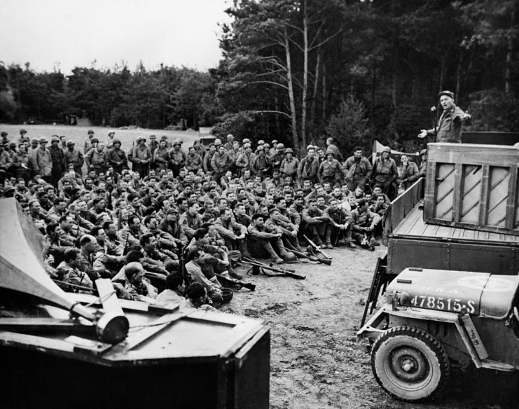 Bing Crosby performing in front of a crowd of US soldiers