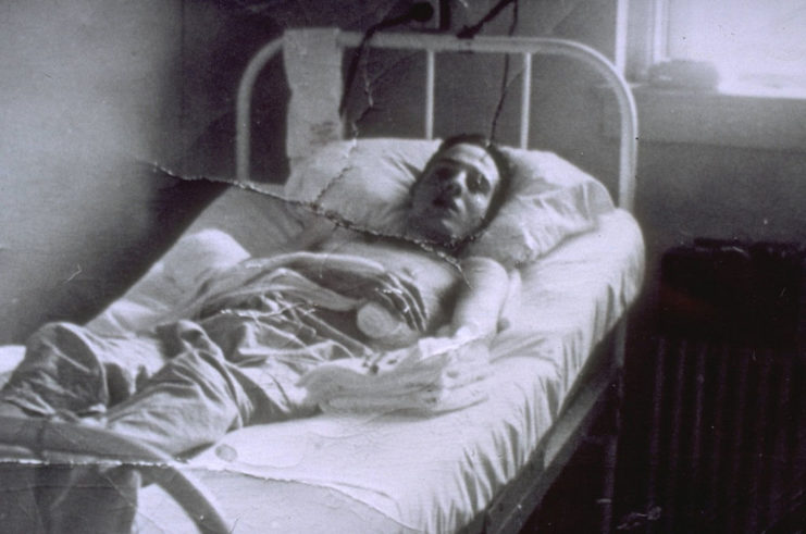 Bob Dole lying in a hospital bed