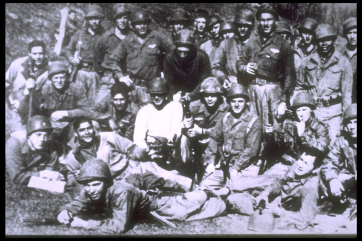 Bob Dole standing with his comrades during the war