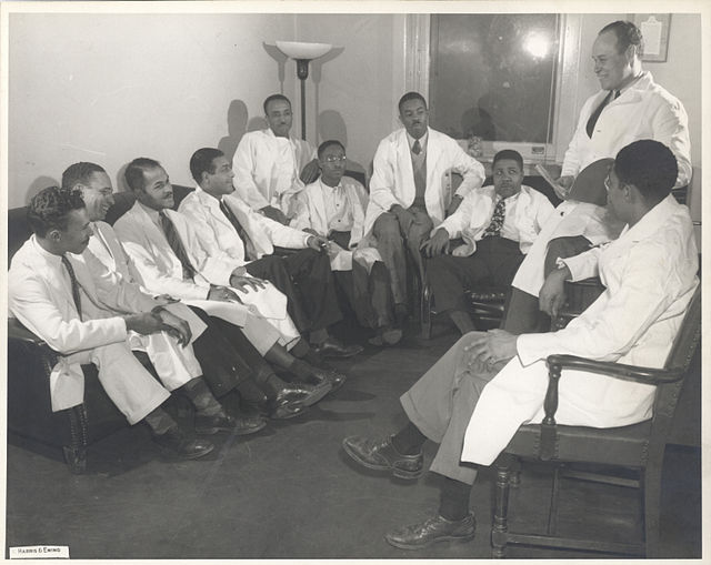 Charles R. Drew sitting amongst other physicians