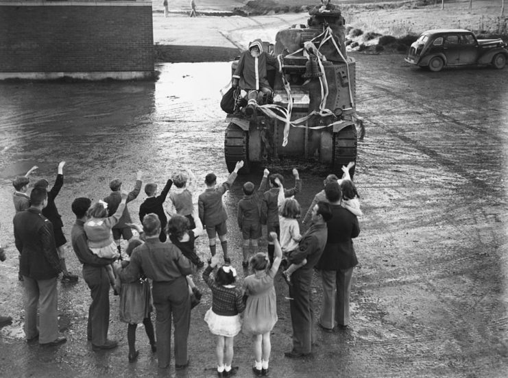 British children piled around an American tank
