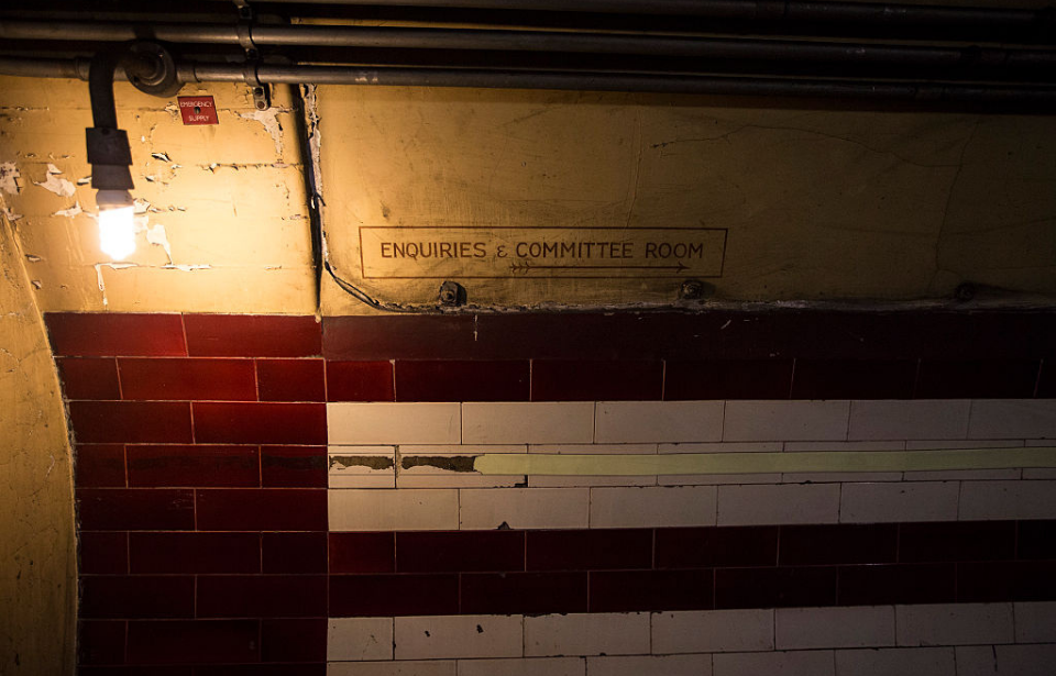 Tunnel dimly-lit by a single lightbulb