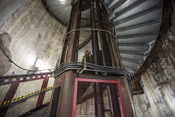 Woman standing on a spiral staircase