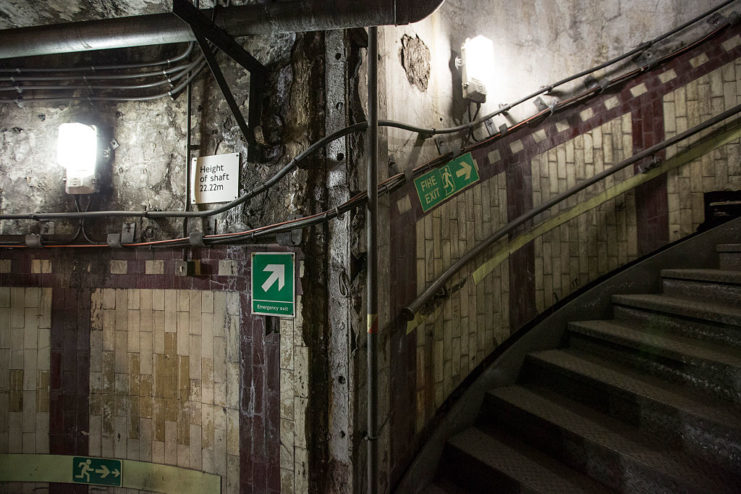 Dimly-lit stairway at Down Street Tube Station