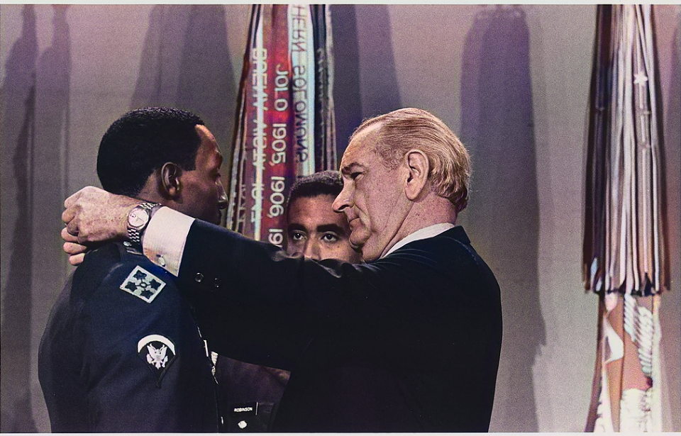 Lyndon B. Johnson placing the Medal of Honor around Dwight Johnson's neck