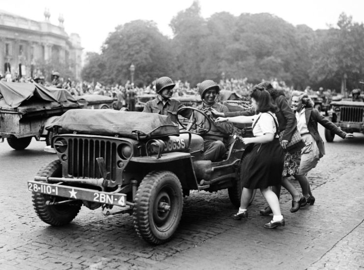 Women running up to a Jeep