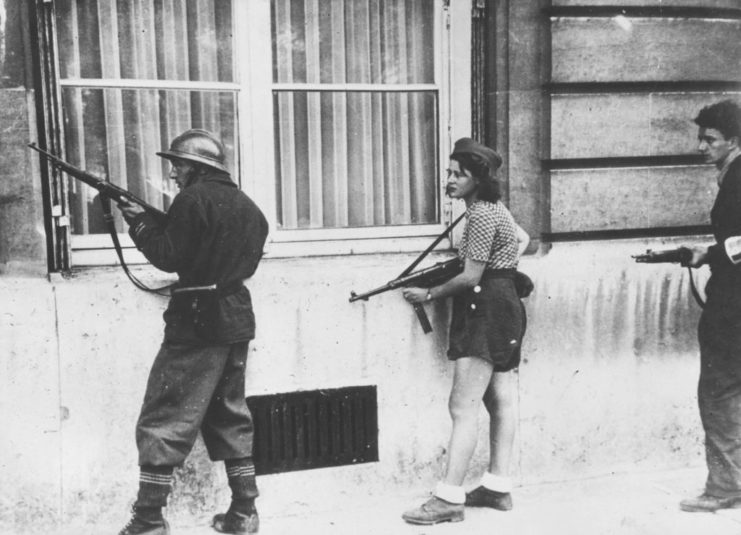 Three French Resistance fighters holding guns