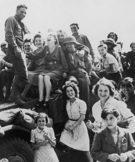 Crowd of women and US soldiers