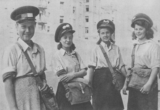 Four Girl Guides with mailbags