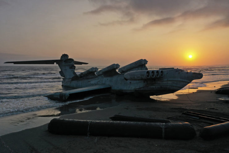 Lun-class ekranoplan sitting on the beach at sunset