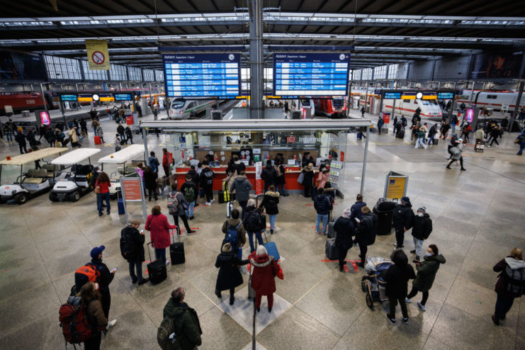 Train passengers queuing in front of the information desk