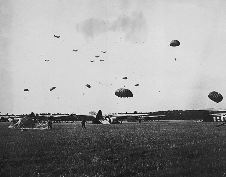Paratroopers landing in a field