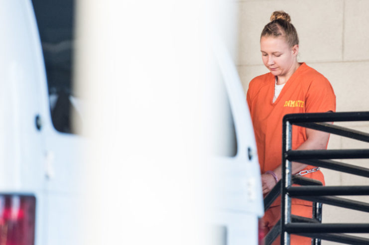 Reality Winner wearing an orange prison jumpsuit