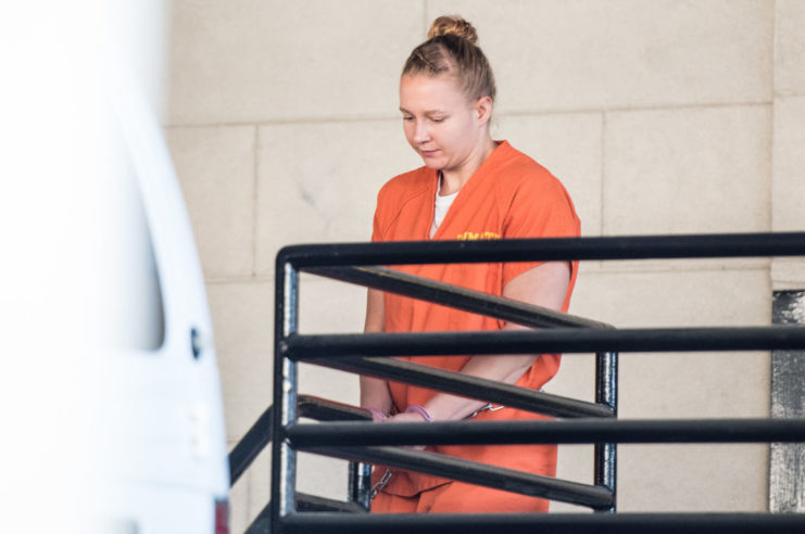 Reality Winner wearing an orange prison jumpsuit