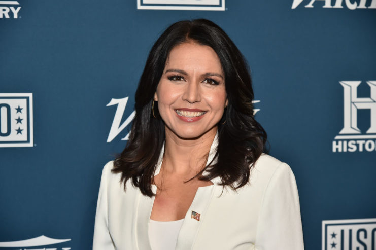 Tulsi Gabbard wearing a white suit