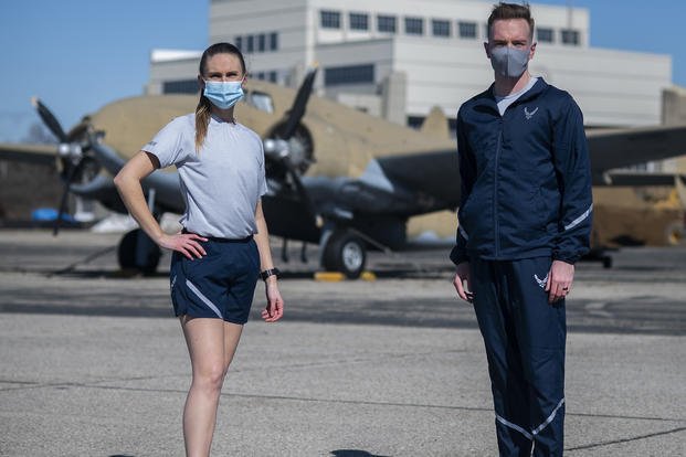 Two US Air Force airmen standing in uniform