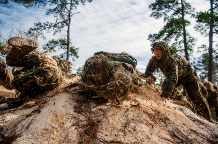 US Army Sniper School trainees in the ghillie wash