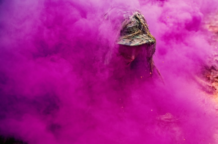 US Army Sniper School trainee shrouded in magenta smoke