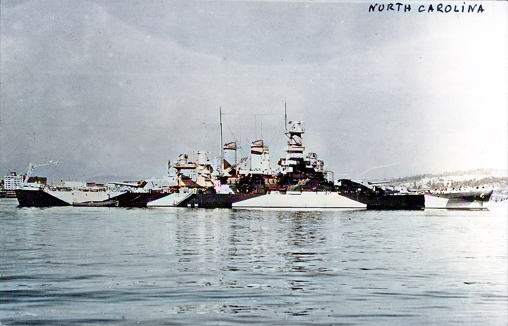 United States Navy Battleship USS North Carolina with dazzle camouflage at sea, date not given.
(Photo Credit: Arkivi / Contributor / Hulton Archives / Getty Images) - Photo colorized for editorial purposes.