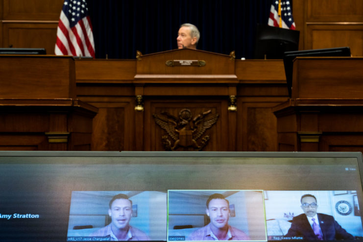 Marine Corps veteran Joey Jones appearing on a screen before Chairman Stephen Lynch