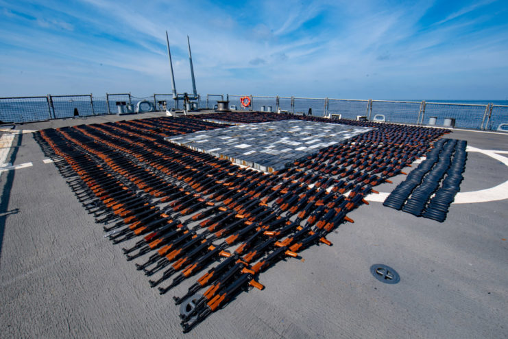 AK-47 assault rifles lined up on the USS O'Kane's flight deck