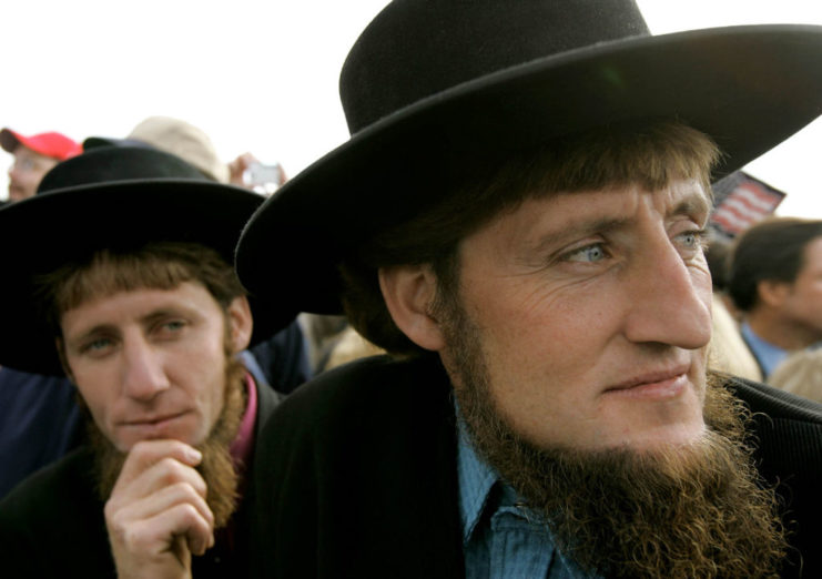 Two Amish men looking pensive