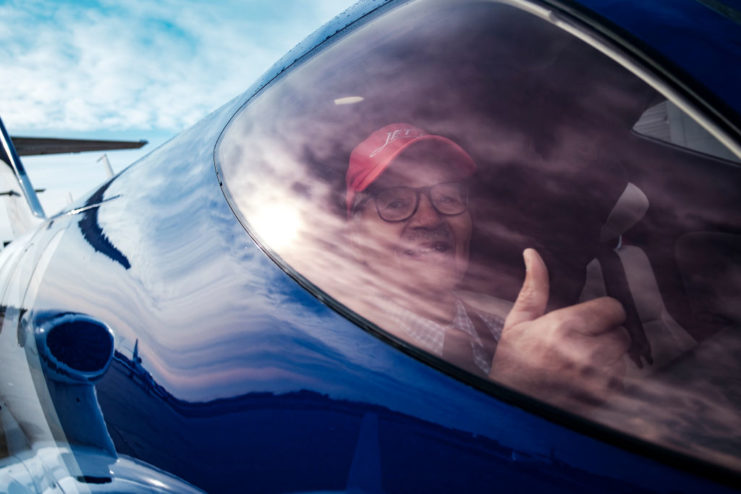 Charles McGee holding a thumbs up while in the cockpit of a Honda Jet