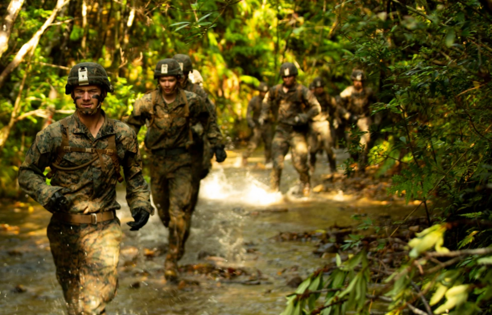 Island Warriors running through the jungle