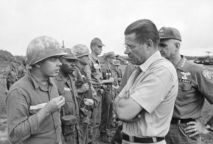 Robert McNamara speaking with Lieutenant Van Buren Wake Jr.