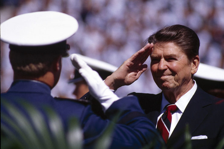 Ronald Reagan saluting West Point graduates