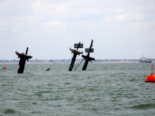 Masts of the sunken SS Richard Montgomery poking above the water