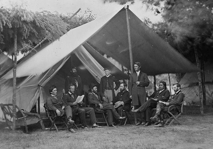 Ulysses S. Grant standing with his staff under a tent