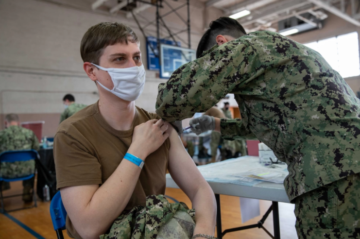 Lt. Colleton Miller receiving the COVID-19 vaccine