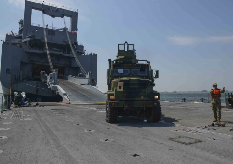 ACB 2 members offloading military vehicles