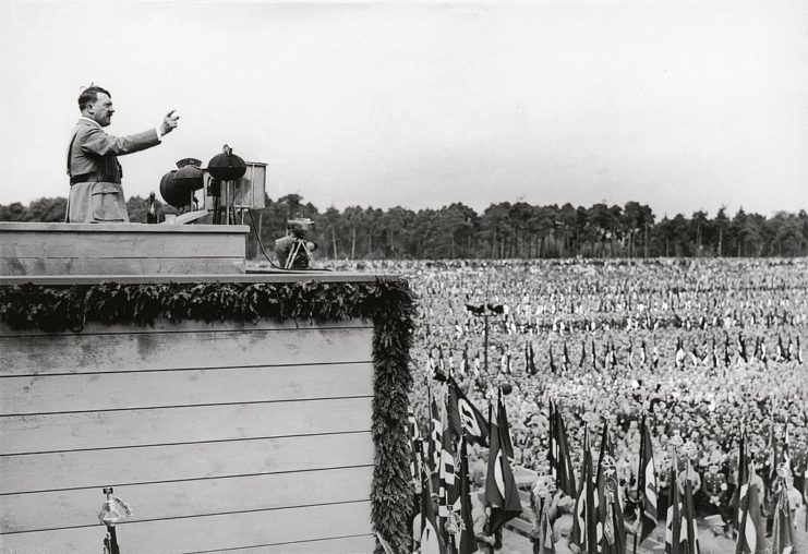 Adolf Hitler speaking before a large crowd