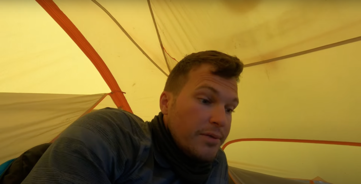 Alexander Seling lying in a tent