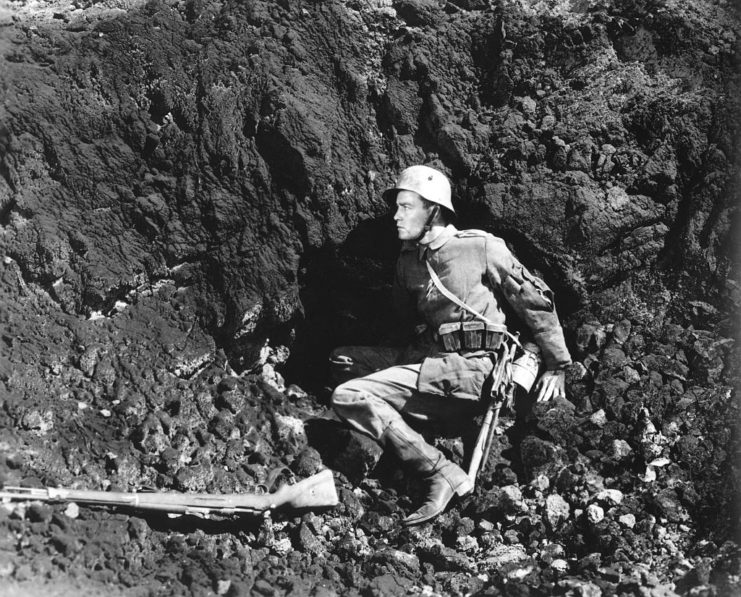 Paul Bäumer lying in a trench