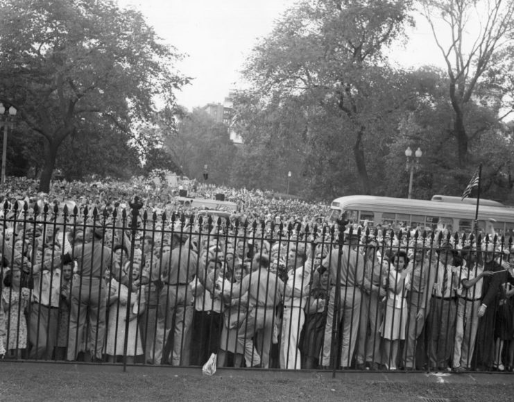 Military Police keeping a crowd of people back at the gates to the White House