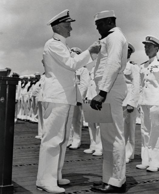Admiral Chester Nimitz Awards Dorie Miller with the Navy Cross 