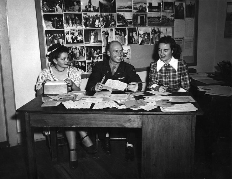 Gail S. Halvorsen sitting at a table with Gisela Hering and Margaret Preston