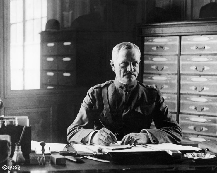 Gen. John J. Pershing sits at his desk