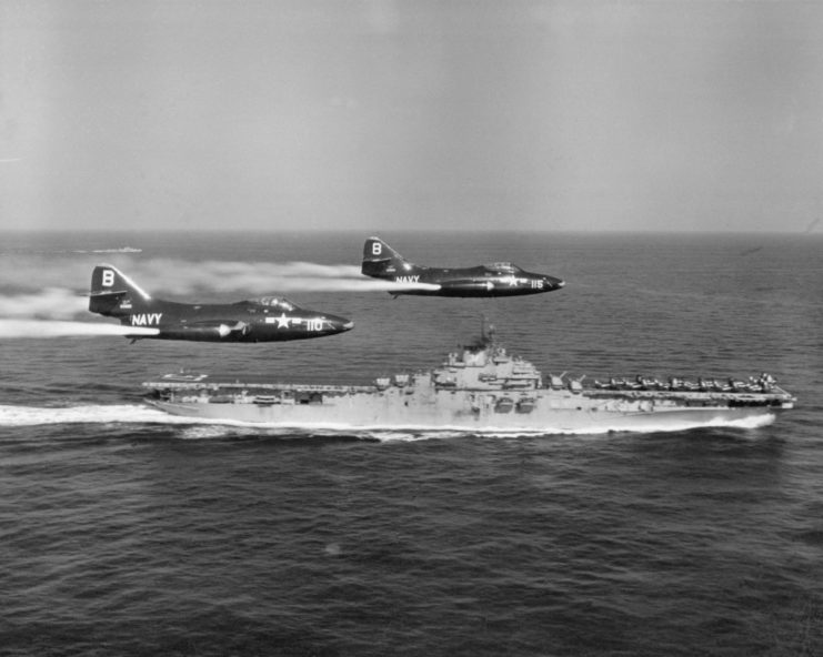 Two Grumman F9F Panthers flying over the USS Princeton