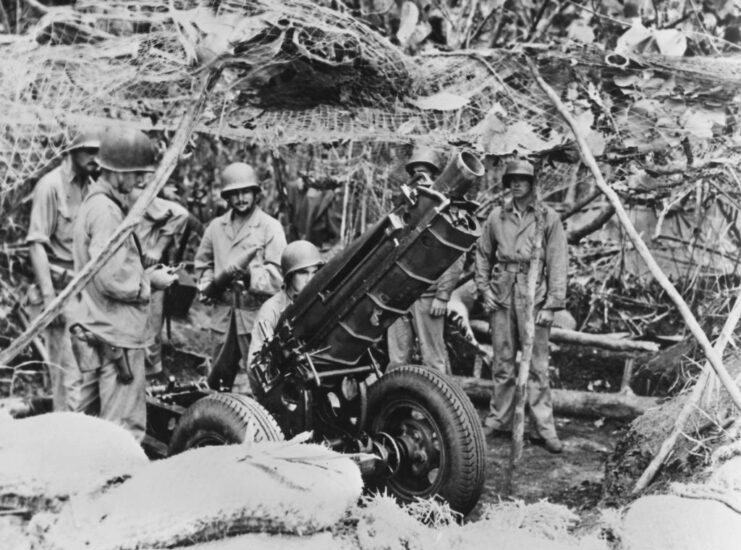 US Marines manning a 75 mm Pack Howitzer M1 in the jungle on Guadalcanal