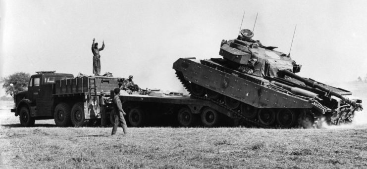 An Indian tank is towed from the Pakistani border