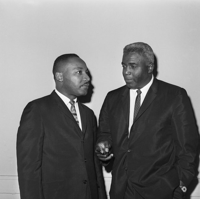 Martin Luther King Jr. standing with Jackie Robinson