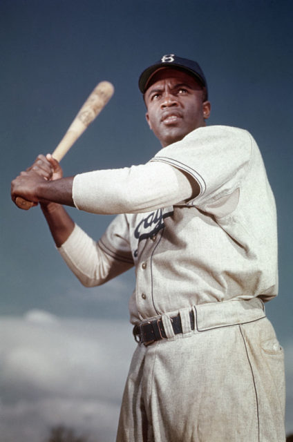 Jackie Robinson holding a baseball bat