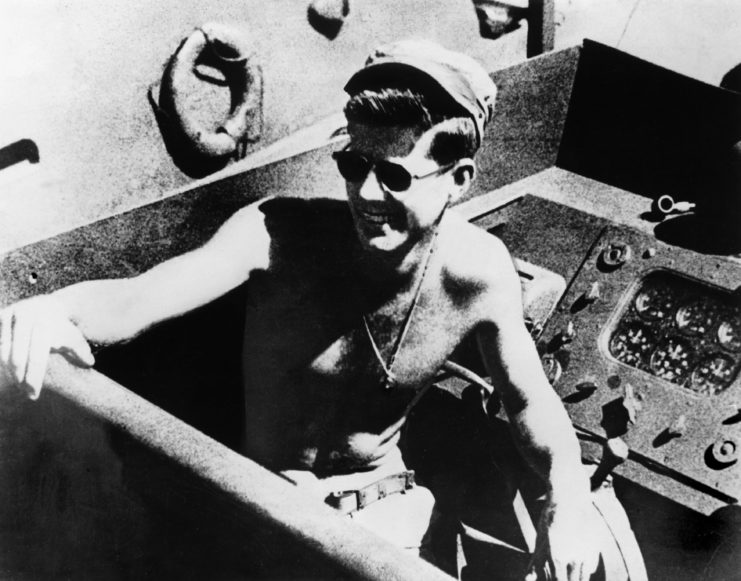 John F. Kennedy sitting in a PT boat