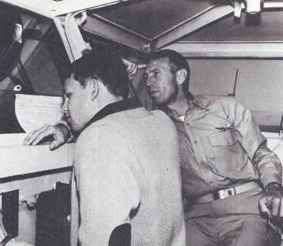 Jim and George Stephen Morrison sitting in the bridge of the USS Bon Homme Richard (CV-31)
